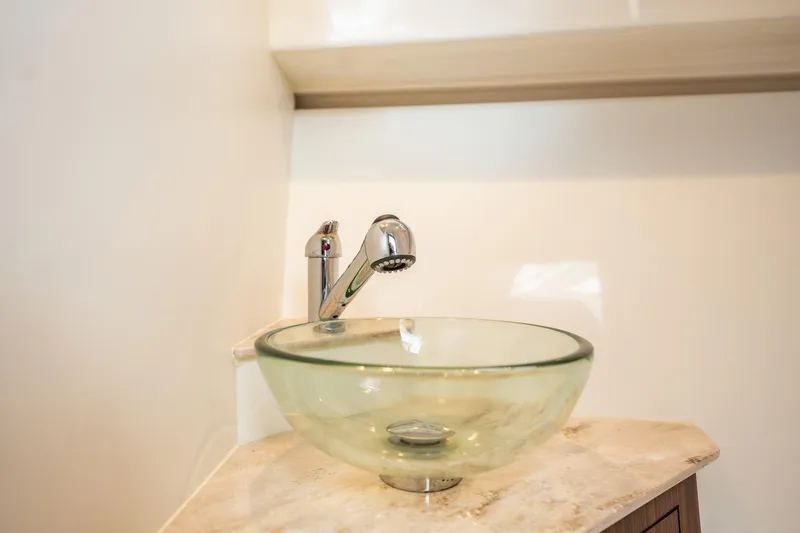 Slide: The Image of Glass bowl sink with modern faucet in 2024 Pursuit OS 325 Offshore boat. - 28