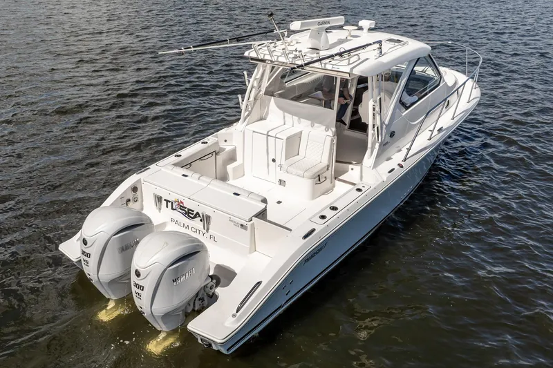 Slide: The Image of 2024 Pursuit OS 325 Offshore boat on water, featuring dual Yamaha engines. - 3