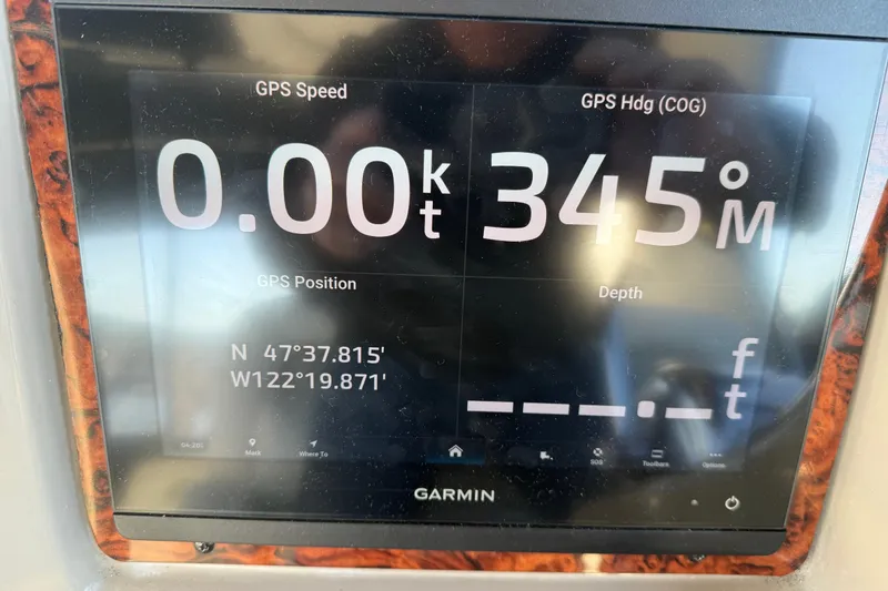 Slide: The Image of Garmin GPS display on 2006 Sea Ray Sundancer 320 showing speed, heading, and coordinates. - 15