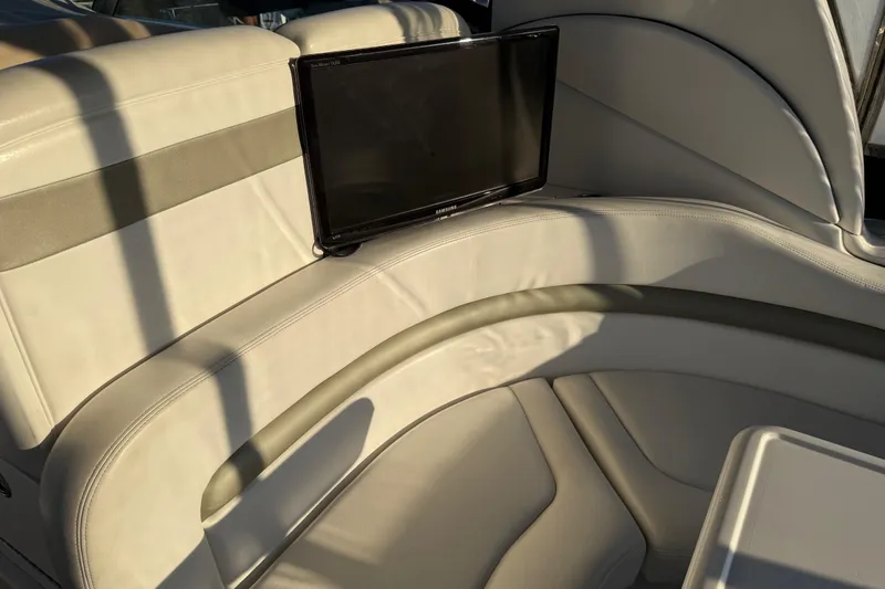 Slide: The Image of Luxurious seating area on 2006 Sea Ray Sundancer 320 yacht with built-in screen. - 19