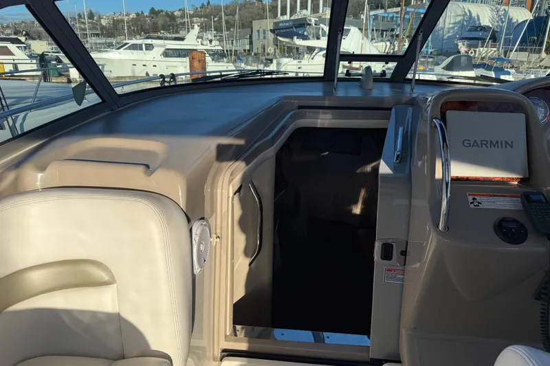 Slide: The Image of Interior view of a 2006 Sea Ray Sundancer 320 boat with Garmin navigation system. - 24