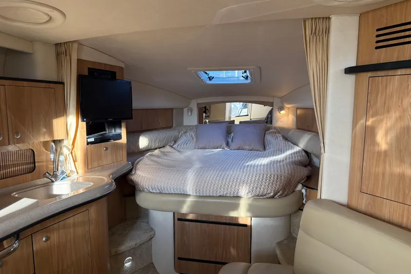 Slide: The Image of Interior of 2006 Sea Ray Sundancer 320 yacht with cozy bed and modern amenities. - 26
