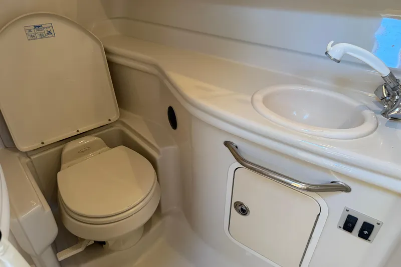Slide: The Image of 2006 Sea Ray Sundancer 320 bathroom with toilet, sink, and faucet. - 40