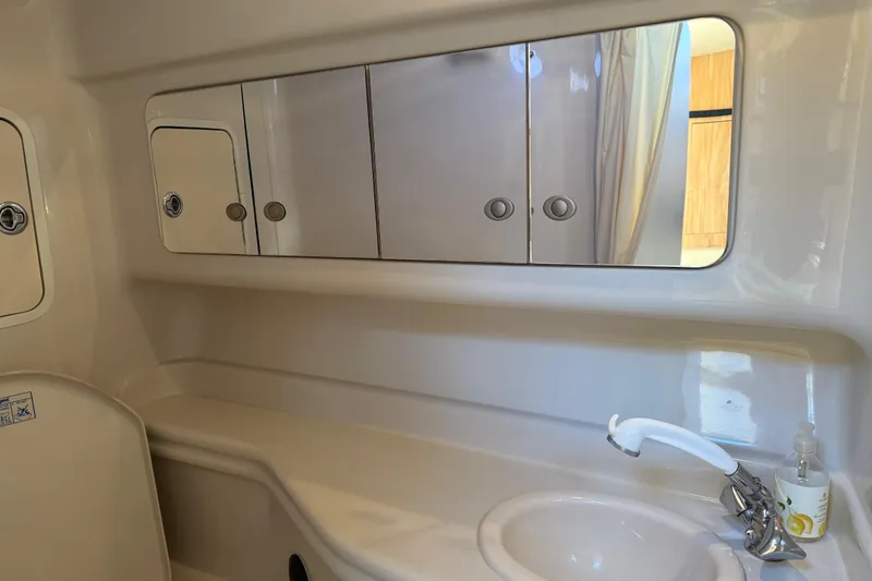 Slide: The Image of Interior of Sea Ray Sundancer 320 yacht, bathroom with mirror and sink. - 41