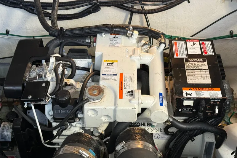 Slide: The Image of Engine compartment of a 2006 Sea Ray Sundancer 320 with Kohler generator system. - 48
