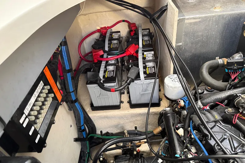 Slide: The Image of Engine compartment of 2006 Sea Ray Sundancer 320 with batteries and wiring. - 49