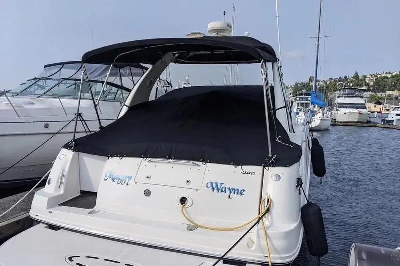 Slide: The Image of 2006 Sea Ray Sundancer 320 docked at marina, covered and secured. - 56