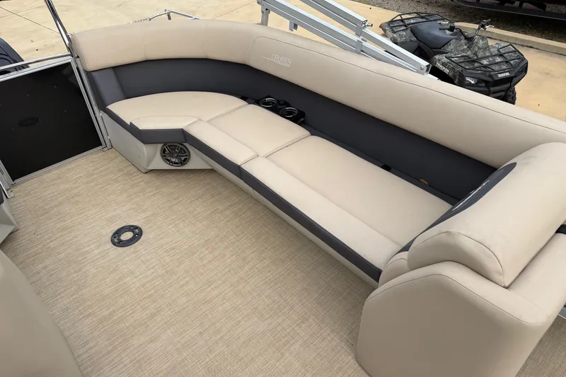 Slide: The Image of 2025 Harris Cruiser 230 interior with beige seating and spacious layout. - 5