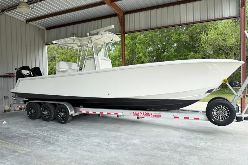 The Image of 2019 SeaVee 320B boat on trailer in covered storage area. - 0