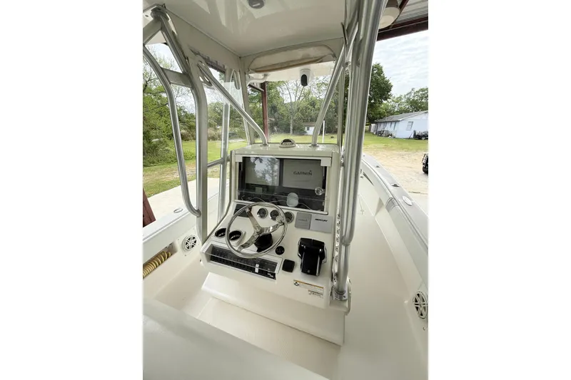 Slide: The Image of 2019 SeaVee 320B boat console with Garmin navigation system and steering wheel. - 12