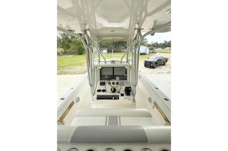 Slide: The Image of 2019 SeaVee 320B boat cockpit with steering wheel and navigation system. - 15