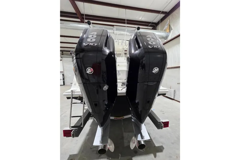 Slide: The Image of 2019 SeaVee 320B boat with dual 400 V10 outboard engines in a warehouse. - 4
