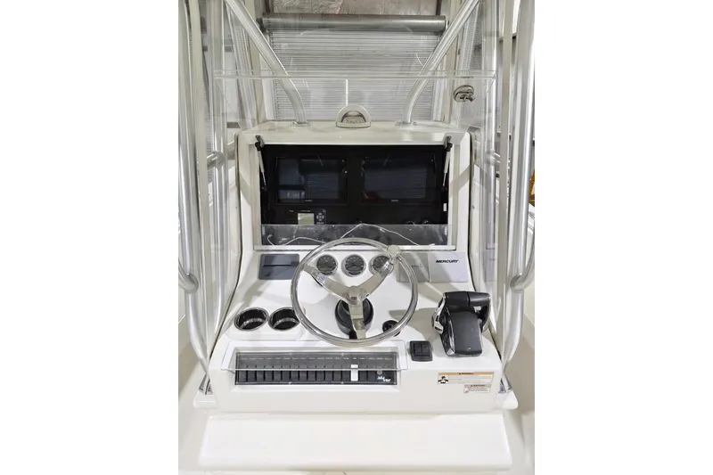 Slide: The Image of 2019 SeaVee 320B boat console with steering wheel and navigation controls. - 7
