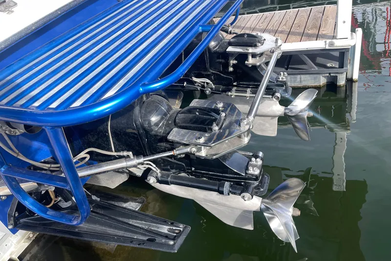 Slide: The Image of 1998 Cigarette 38' Top Gun boat with dual propellers at dock. - 13