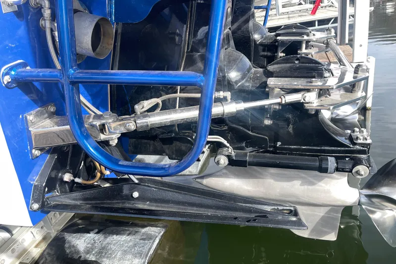 Slide: The Image of Close-up of 1998 Cigarette 38' Top Gun boat engine components and propeller. - 14