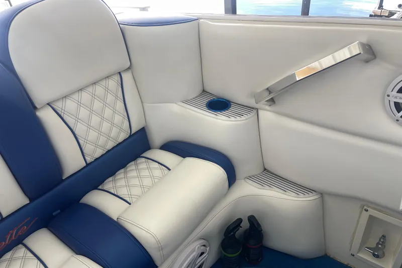 Slide: The Image of Luxurious interior of 1998 Cigarette 38' Top Gun boat with blue and white seating. - 15