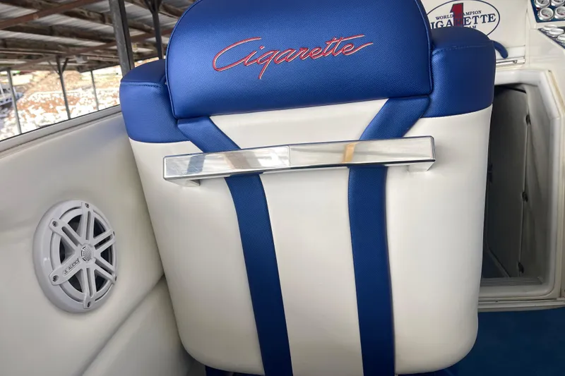 Slide: The Image of Blue and white seat on 1998 Cigarette 38' Top Gun boat, featuring branded embroidery. - 21