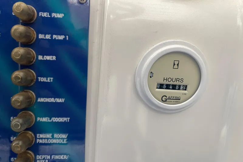Slide: The Image of Control panel and hour meter of a 1998 Cigarette 38' Top Gun boat. - 27