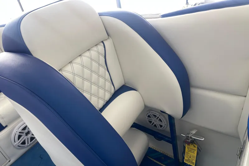 Slide: The Image of 1998 Cigarette 38' Top Gun boat interior with blue and white seating. - 32