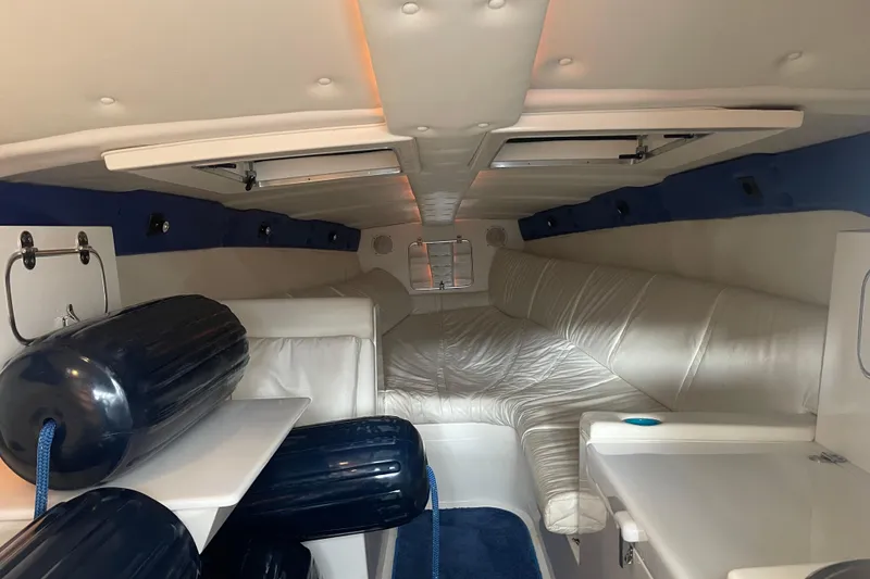 Slide: The Image of Interior of a 1998 Cigarette 38' Top Gun boat with white leather seating. - 35