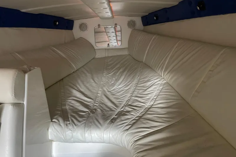 Slide: The Image of Interior cabin of 1998 Cigarette 38' Top Gun boat with white leather seating. - 39