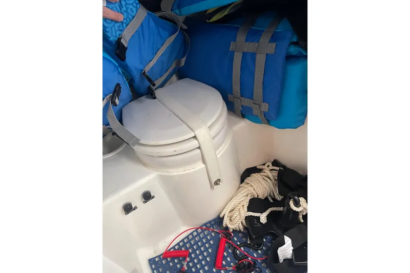 Slide: The Image of 1998 Cigarette 38' Top Gun boat interior with life jackets and ropes. - 42