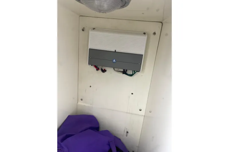 Slide: The Image of 1998 Cigarette 38' Top Gun interior with mounted electronic device. - 43