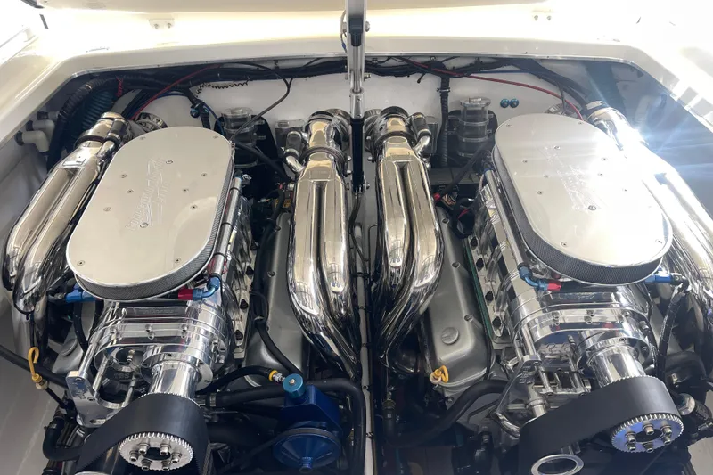 Slide: The Image of 1998 Cigarette 38' Top Gun engine compartment with dual high-performance engines. - 44