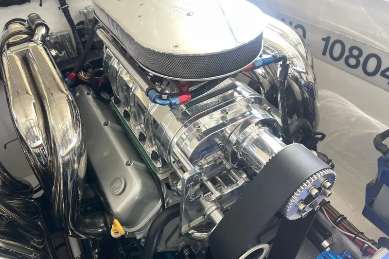 Slide: The Image of 1998 Cigarette 38' Top Gun engine with polished chrome components and intricate detailing. - 45