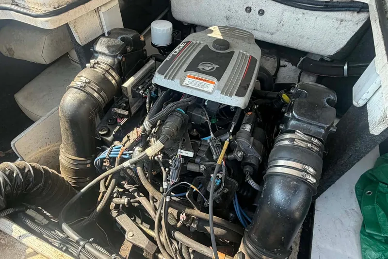 Slide: The Image of Engine compartment of a 2009 Regal 2500 Bowrider boat, showcasing detailed components. - 16