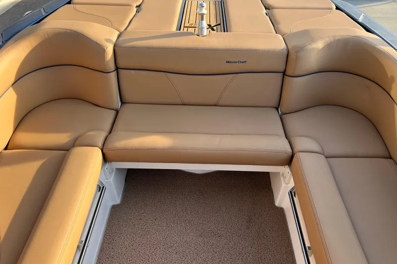 Slide: The Image of Luxurious tan seating on 2022 MasterCraft XT25 boat, showcasing comfort and style. - 11