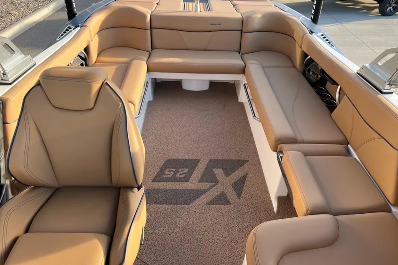Slide: The Image of Luxurious interior of 2022 MasterCraft XT25 boat with tan leather seating. - 13