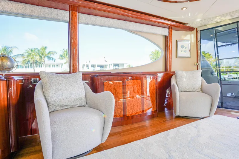 Slide: The Image of Luxurious interior of 2004 Lazzara 80 SL yacht with elegant seating and wood finishes. - 24