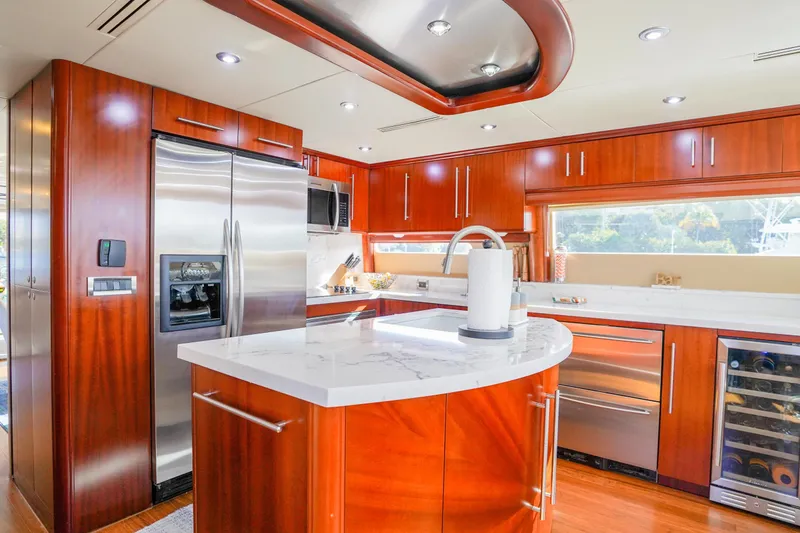 Slide: The Image of Luxurious kitchen interior of 2004 Lazzara 80 SL yacht with modern appliances and wood cabinetry. - 31