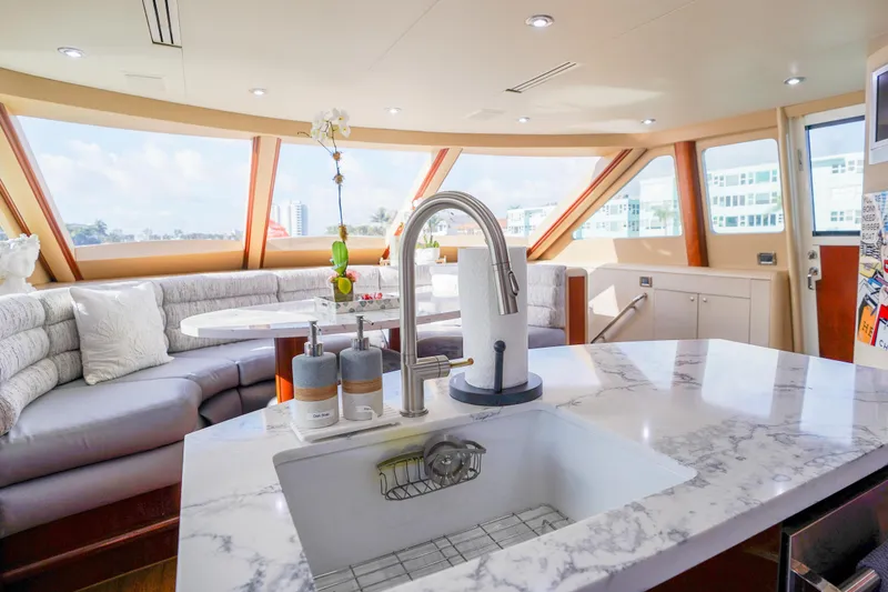 Slide: The Image of Luxurious interior of 2004 Lazzara 80 SL yacht with modern kitchen and seating area. - 33