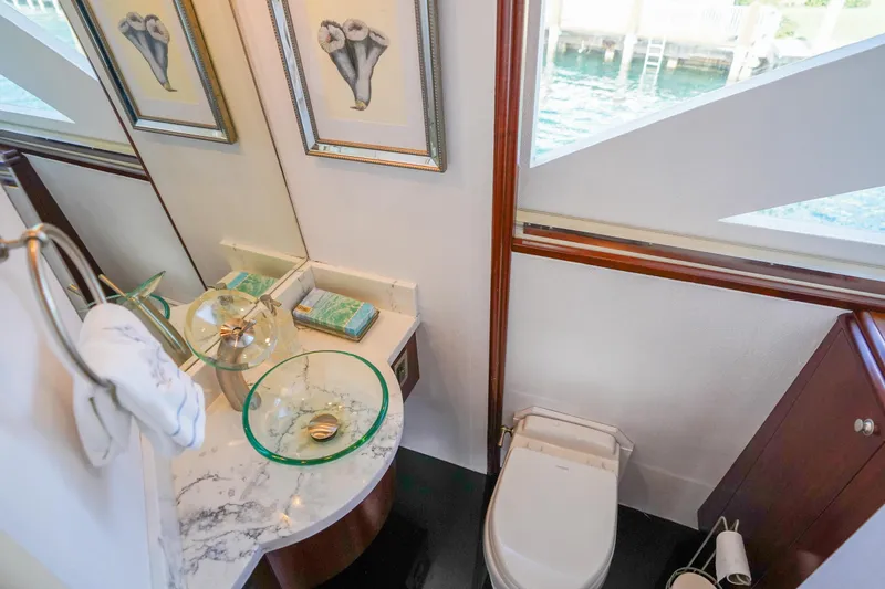 Slide: The Image of Luxurious bathroom on 2004 Lazzara 80 SL yacht with glass sink and elegant decor. - 36