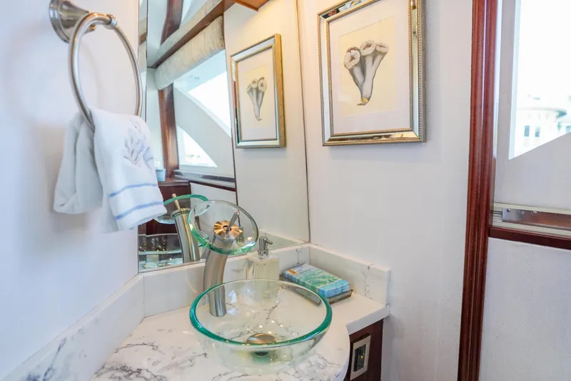 Slide: The Image of Luxurious bathroom on 2004 Lazzara 80 SL yacht with glass sink and elegant decor. - 38