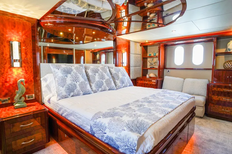Slide: The Image of Luxurious bedroom interior of 2004 Lazzara 80 SL yacht with elegant wood finishes. - 42