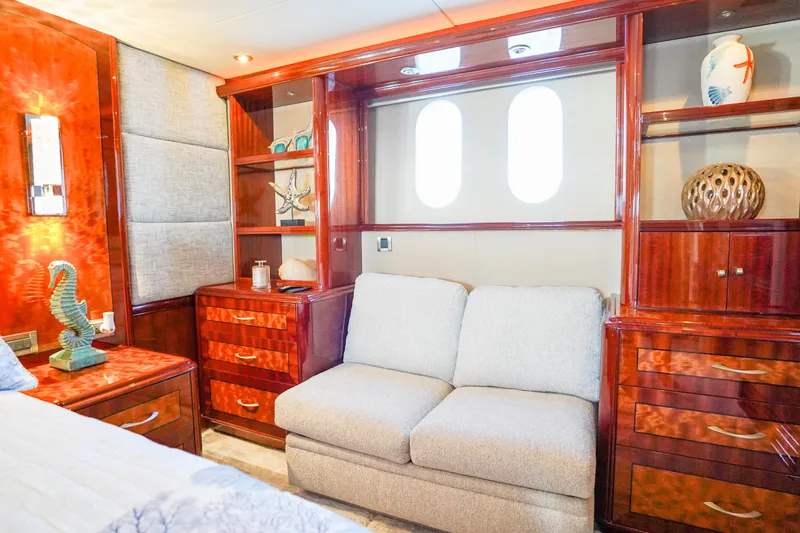 Slide: The Image of Luxurious interior of 2004 Lazzara 80 SL yacht with elegant wood cabinetry and plush seating. - 44