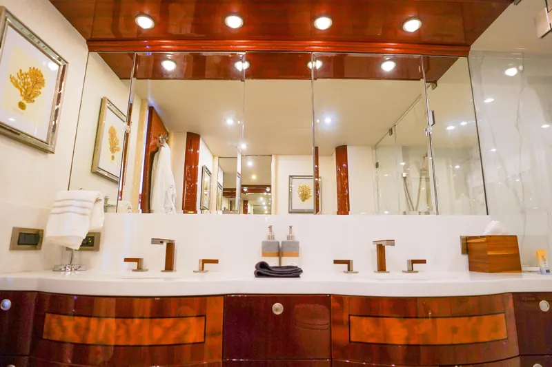 Slide: The Image of Luxurious bathroom interior on 2004 Lazzara 80 SL yacht with elegant wood finishes. - 46