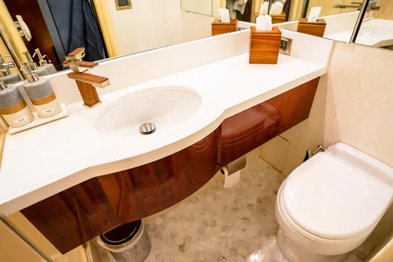 Slide: The Image of Luxurious bathroom in 2004 Lazzara 80 SL yacht with modern sink and toilet. - 56