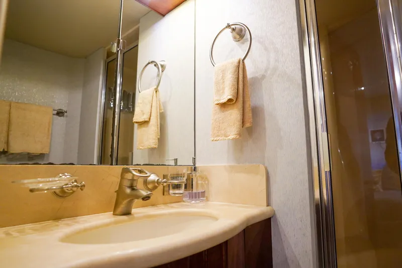 Slide: The Image of Luxurious bathroom in 2004 Lazzara 80 SL yacht with elegant fixtures and towels. - 63