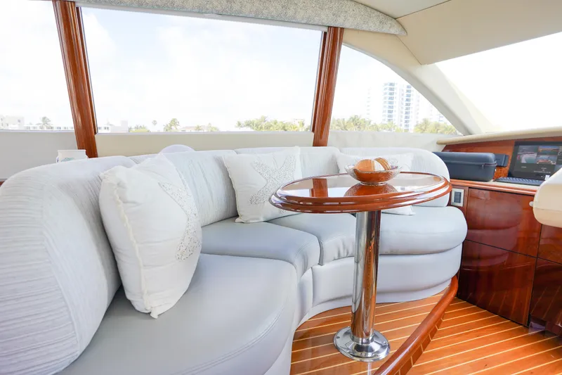 Slide: The Image of Luxurious interior of 2004 Lazzara 80 SL yacht with elegant seating and wooden table. - 65