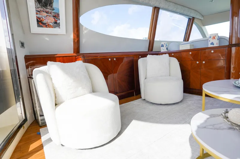 Slide: The Image of Luxurious interior of 2004 Lazzara 80 SL yacht with plush white chairs and elegant decor. - 70
