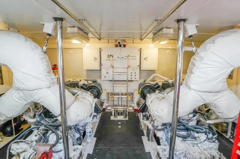 Slide: The Image of Engine room of 2004 Lazzara 80 SL yacht with dual engines and control systems. - 72