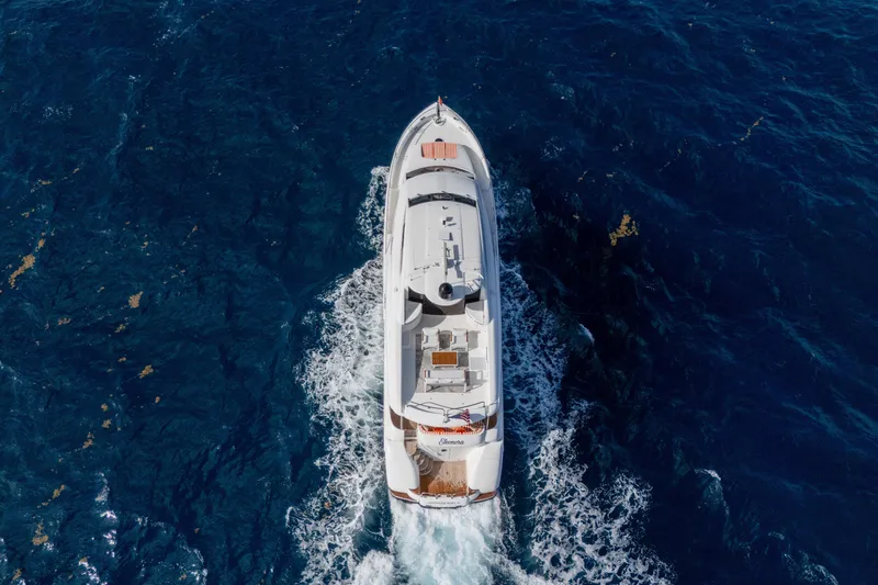 Slide: The Image of Aerial view of 2004 Lazzara 80 SL yacht cruising on deep blue ocean. - 9