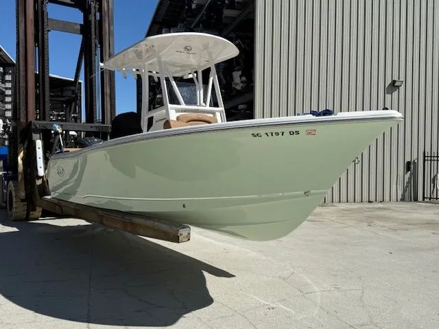 Slide: The Image of 2022 Sea Hunt 234 boat on a forklift. - 0