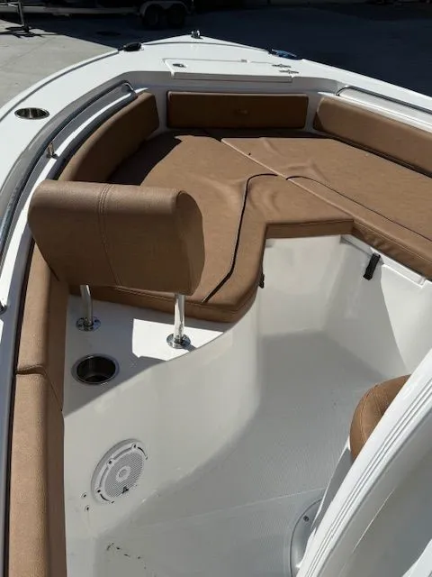 Slide: The Image of Interior view of a 2022 Sea Hunt 234 boat with brown upholstery. - 10