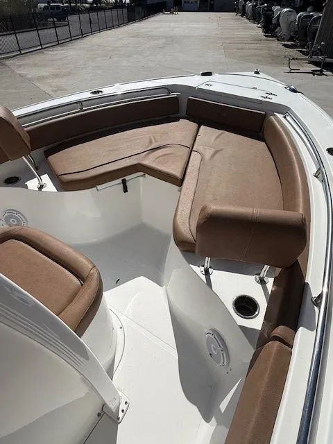 Slide: The Image of Interior view of a 2022 Sea Hunt 234 boat with brown seating. - 11