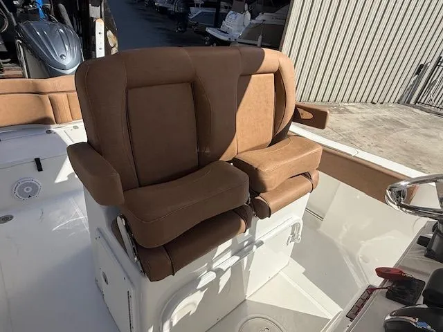 Slide: The Image of Brown leather seats on a 2022 Sea Hunt 234 boat. - 13
